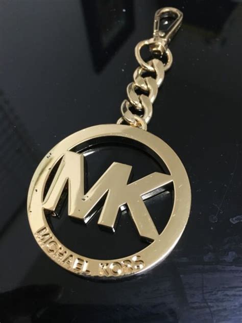 michael kors logo replacement